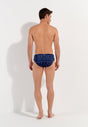 General view of a men model wearing HO navy print  Swim Mini Briefs
