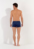 General view of a men model wearing HO navy print  Swim Shorts