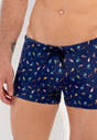 Close-up view of a men model wearing HO navy print  Swim Shorts