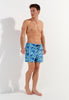 Full-body view of a men model wearing HO blue print  Beach Boxer