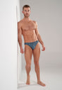 Full-body view of a men model wearing HO dark grey print  Comfort Micro Briefs
