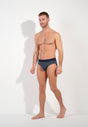Full-body view of a men model wearing HO navy print modal/viscose/tencel Mini Briefs
