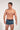 Front view of a men model wearing HO navy blue print  Trunk