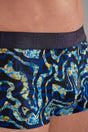 Close-up view of a men model wearing HO navy blue print  Trunk