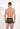 Back view of a men model wearing HO khaki print  Trunk