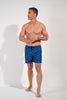 Full-body view of a men model wearing HO navy print  Beach Boxer