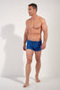 Full-body view of a men model wearing HO navy print  Swim Shorts