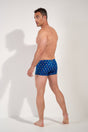 General view of a men model wearing HO navy print  Swim Shorts