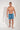 Full-body view of a men model wearing HO blue print  Beach Boxer