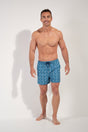 Full-body view of a men model wearing HO blue print  Beach Boxer