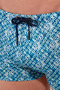 Close-up view of a men model wearing HO blue print  Swim Shorts