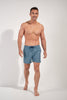 Full-body view of a men model wearing HO blue print  Beach Boxer