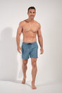 Full-body view of a men model wearing HO blue print  Beach Boxer