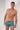 General view of a men model wearing HO blue print  Swim Shorts