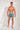 Full-body view of a men model wearing HO blue print  Swim Shorts