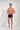 Full-body view of a men model wearing HO red print modal/viscose/tencel Trunk