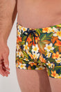 Close-up view of a men model wearing HO navy print  Swim Shorts