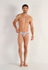 Full-body view of a men model wearing HO white print  Comfort Micro Briefs
