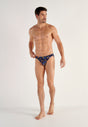 Full-body view of a men model wearing HO black print  Comfort Micro Briefs