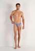 Full-body view of a men model wearing HO navy print  Comfort Micro Briefs