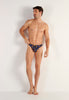Full-body view of a men model wearing HO black print  G-String