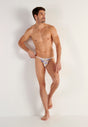 Full-body view of a men model wearing HO white print  Tanga Briefs
