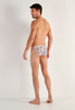 General view of a men model wearing HO white print  Tanga Briefs
