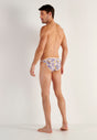 General view of a men model wearing HO white print  Tanga Briefs