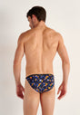 Back view of a men model wearing HO black print  Tanga Briefs