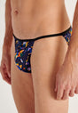 Close-up view of a men model wearing HO black print  Tanga Briefs