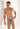 Front view of a men model wearing HO blue print  Tanga Briefs