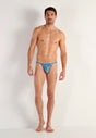 Full-body view of a men model wearing HO blue print  Tanga Briefs