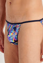 Close-up view of a men model wearing HO navy print  Tanga Briefs