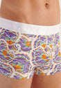 Close-up view of a men model wearing HO white print  Trunk