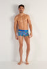 Full-body view of a men model wearing HO blue print  Trunk