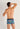 Back view of a men model wearing HO navy blue print  Trunk