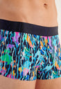 Close-up view of a men model wearing HO navy blue print  Trunk