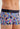 Close-up view of a men model wearing HO navy print  Trunk