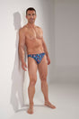 Full-body view of a men model wearing HO multico print  Comfort Micro Briefs