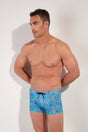Front view of a men model wearing HO blue print  Swim Shorts