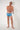 Full-body view of a men model wearing HO blue print  Swim Shorts