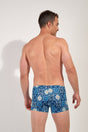 Back view of a men model wearing HO blue print  Swim Shorts