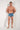 Full-body view of a men model wearing HO blue print  Swim Shorts