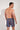 Back view of a men model wearing HO multicolor stripes  Beach Boxer
