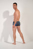 General view of a men model wearing HO multicolor stripes  Swim Trunk