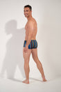 General view of a men model wearing HO multicolor stripes  Swim Trunk