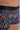 Close-up view of a men model wearing HO multico print  Trunk