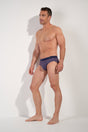 Full-body view of a men model wearing HO red print modal/viscose/tencel Comfort Briefs