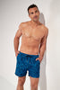 Front view of a men model wearing HO blue print  Beach Boxer