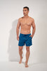 Full-body view of a men model wearing HO blue print  Beach Boxer